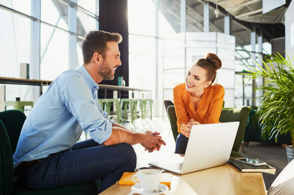 Two business associates discussing customer insights.