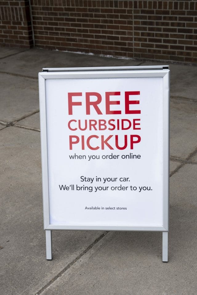 A Sign Reads Free Curbside Pickup Outside Retail Store